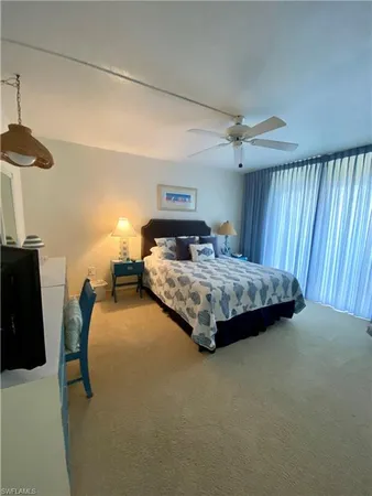 a bedroom with a bed and a table in it