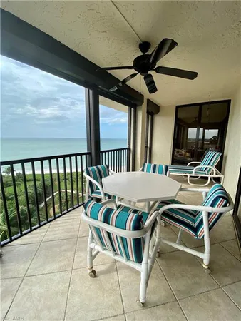 a view of a patio with a table and chairs