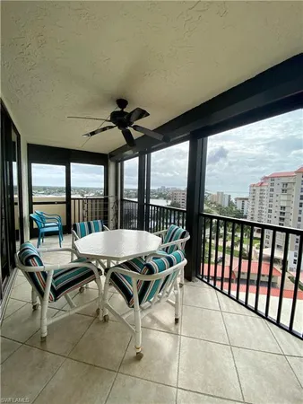 a living room with a large window and table