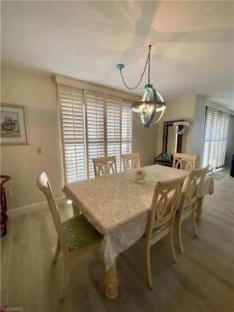 a view of a dining room with furniture and window