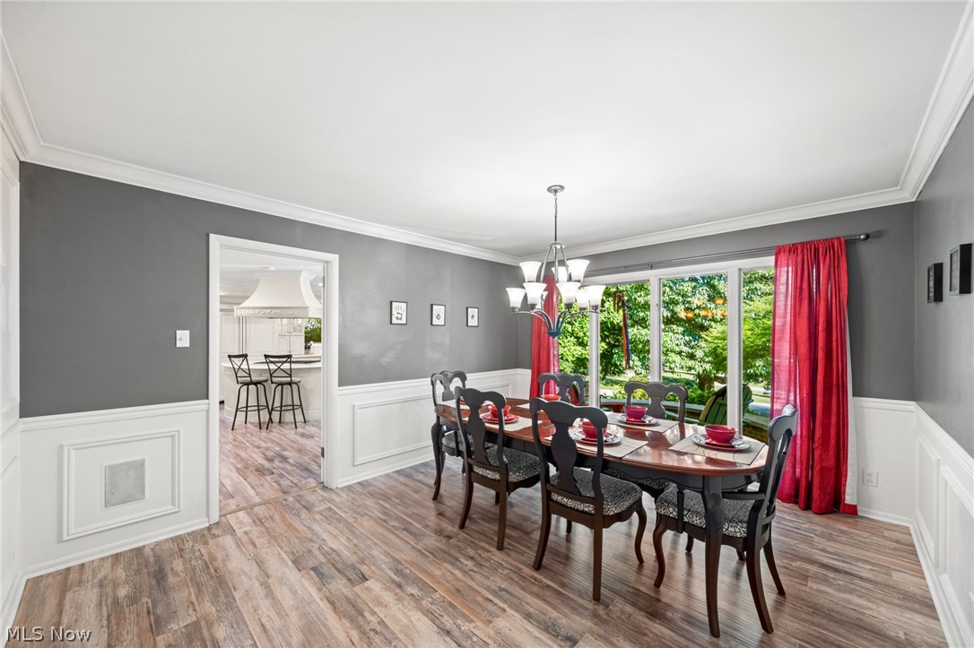 3930 Cardinal Road Akron, OH 44333 - Photo 7 of 34 Dining room with wainscoting, crown molding, large windows and plenty of space for family or entertaining.
