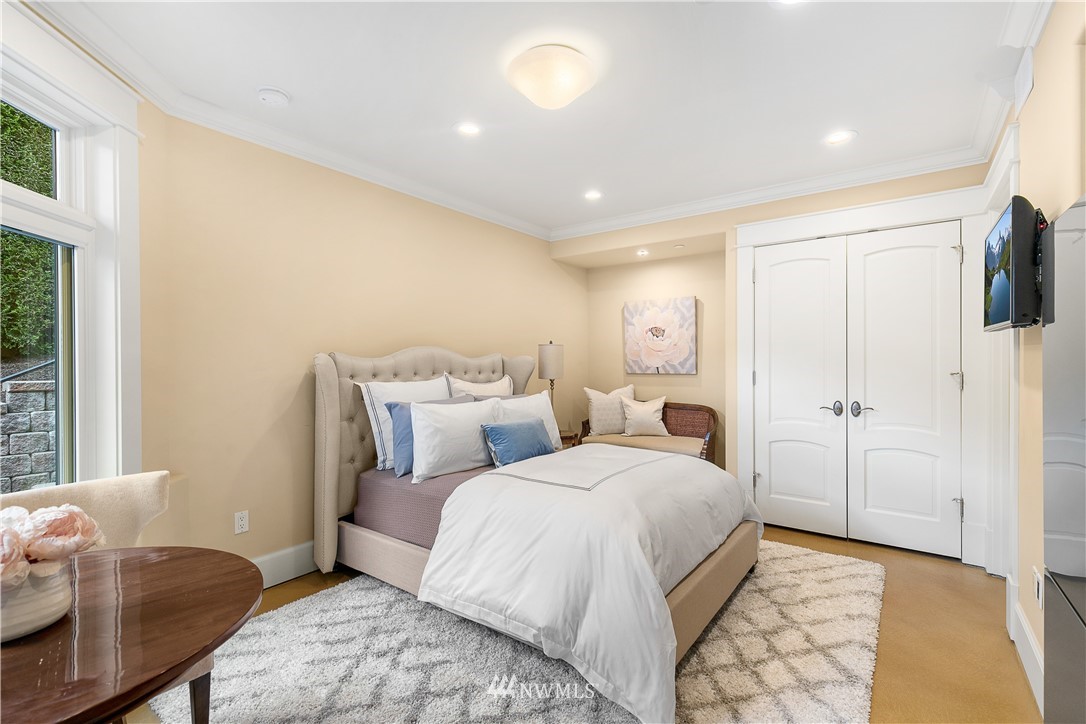 8715 Midland Road Medina, WA 98039 - Photo 22 of 31 a bedroom with double bed and a window
