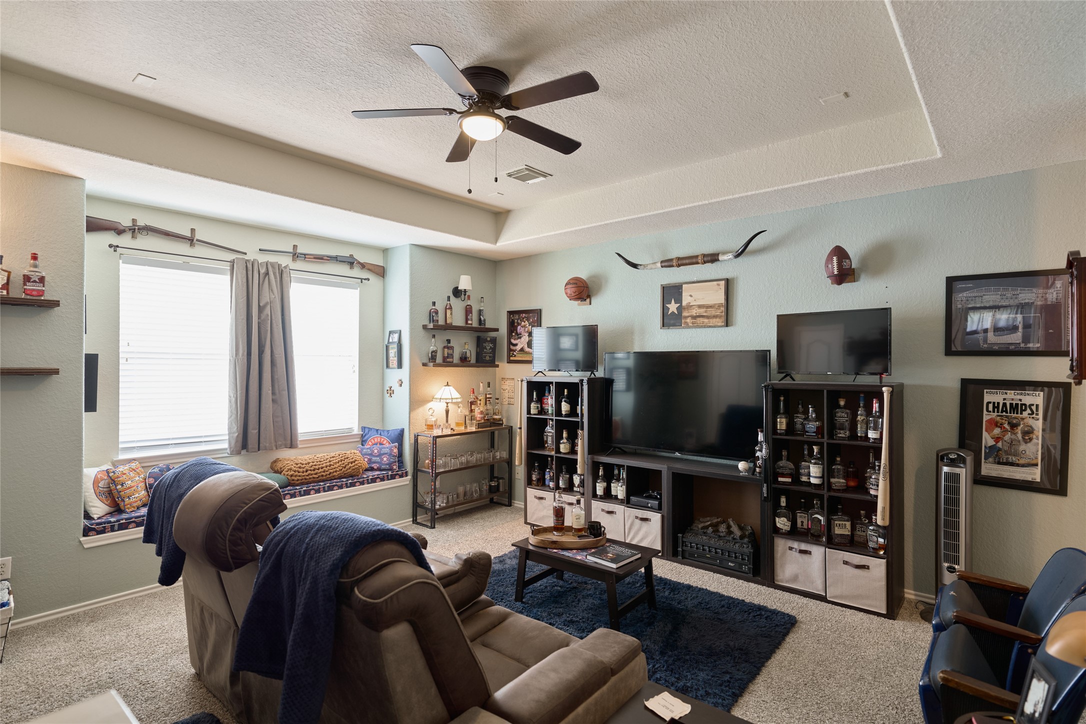 28322 Madelin Manor Lane Spring, TX 77386 - Photo 28 of 46 a living room with furniture workspace and a flat screen tv