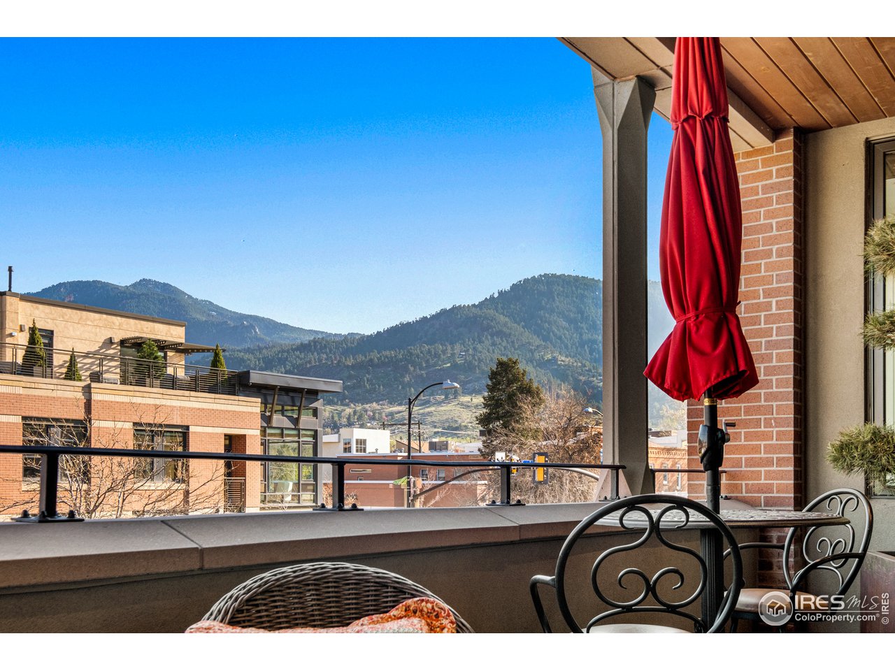 901 Pearl Street, Unit 202 Boulder, CO 80302 - Photo 13 of 35 a view of a balcony with chairs