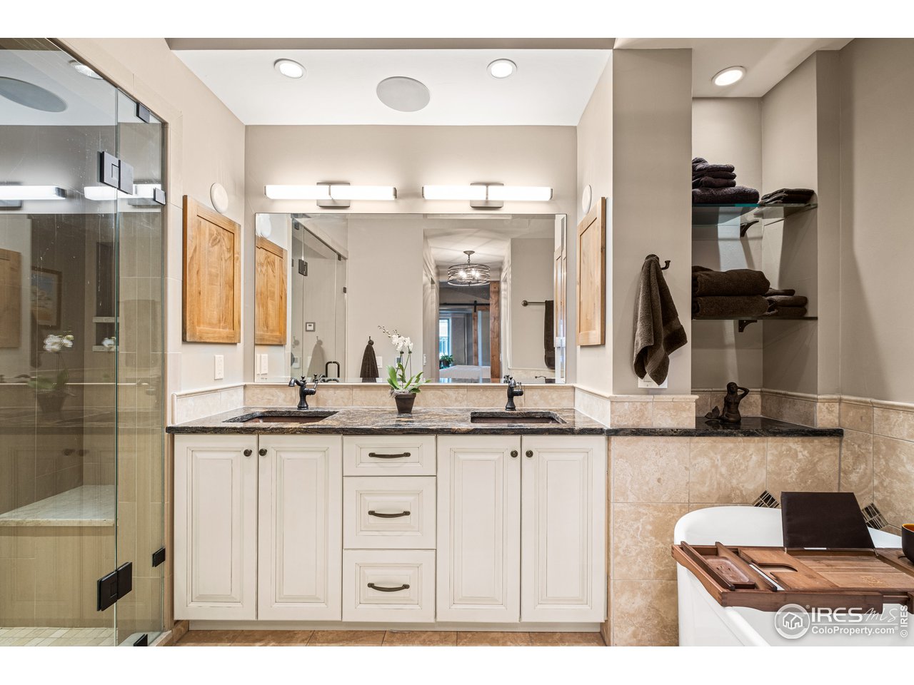 901 Pearl Street, Unit 202 Boulder, CO 80302 - Photo 22 of 35 a bathroom with a double vanity sink and a mirror