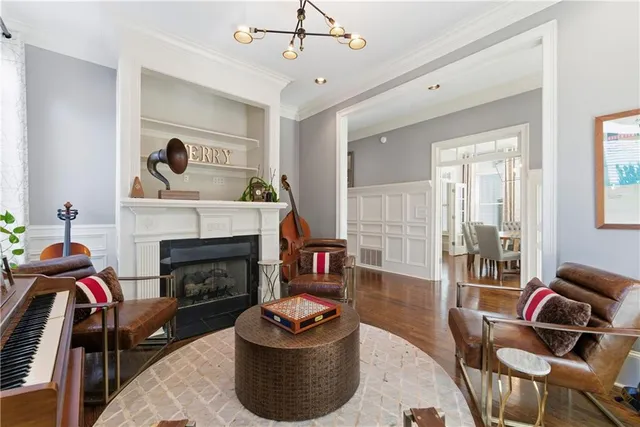 a view of a deck with two chair and wooden floor