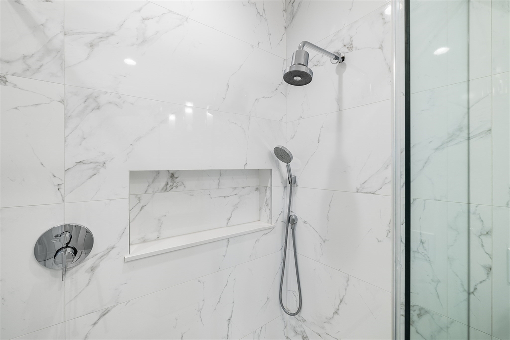39 A Street, Unit 19 Boston, MA 02127 - Photo 14 of 24 a bathroom with a shower