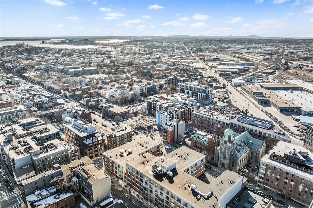 39 A Street, Unit 19 Boston, MA 02127 - Photo 23 of 24 an aerial view of a building with parking space