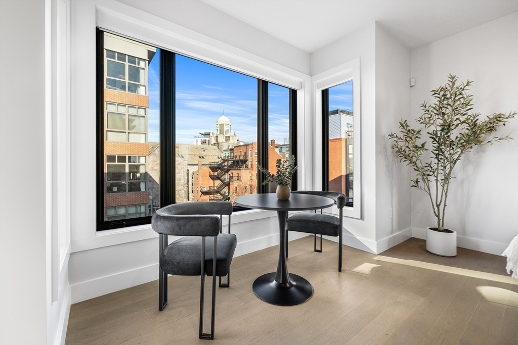 39 A Street, Unit 19 Boston, MA 02127 - Photo 5 of 24 a living room with furniture and a potted plant