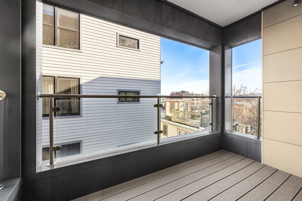 39 A Street, Unit 19 Boston, MA 02127 - Photo 10 of 24 a view of a balcony with city view