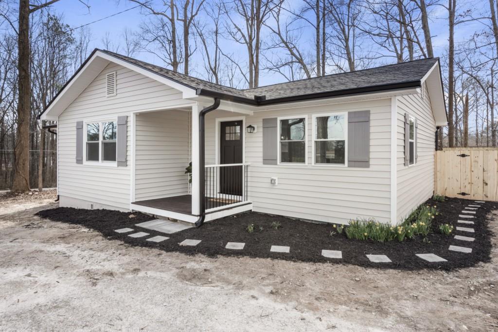 a front view of a house with garden