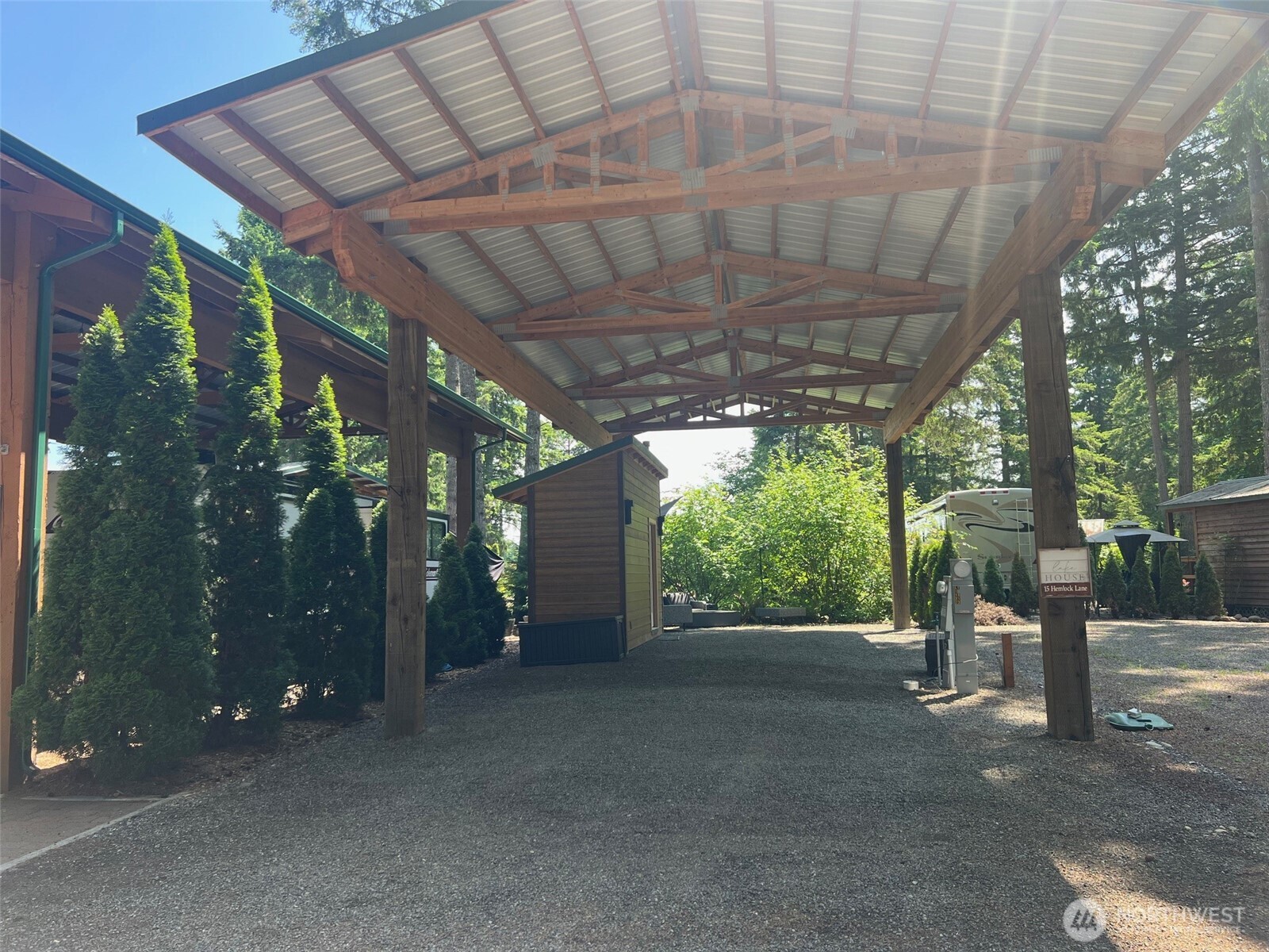 a view of a porch with furniture and a tree
