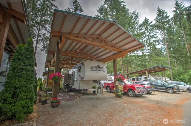 a view of a cars is parked in front of a house