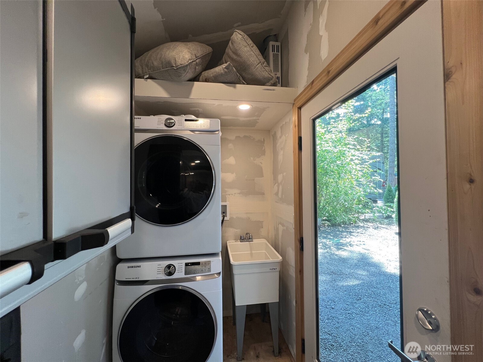 1546 Reservation Road Southeast, Unit 191 Olympia, WA 98513 - Photo 16 of 34 a view of a hallway with washer and dryer