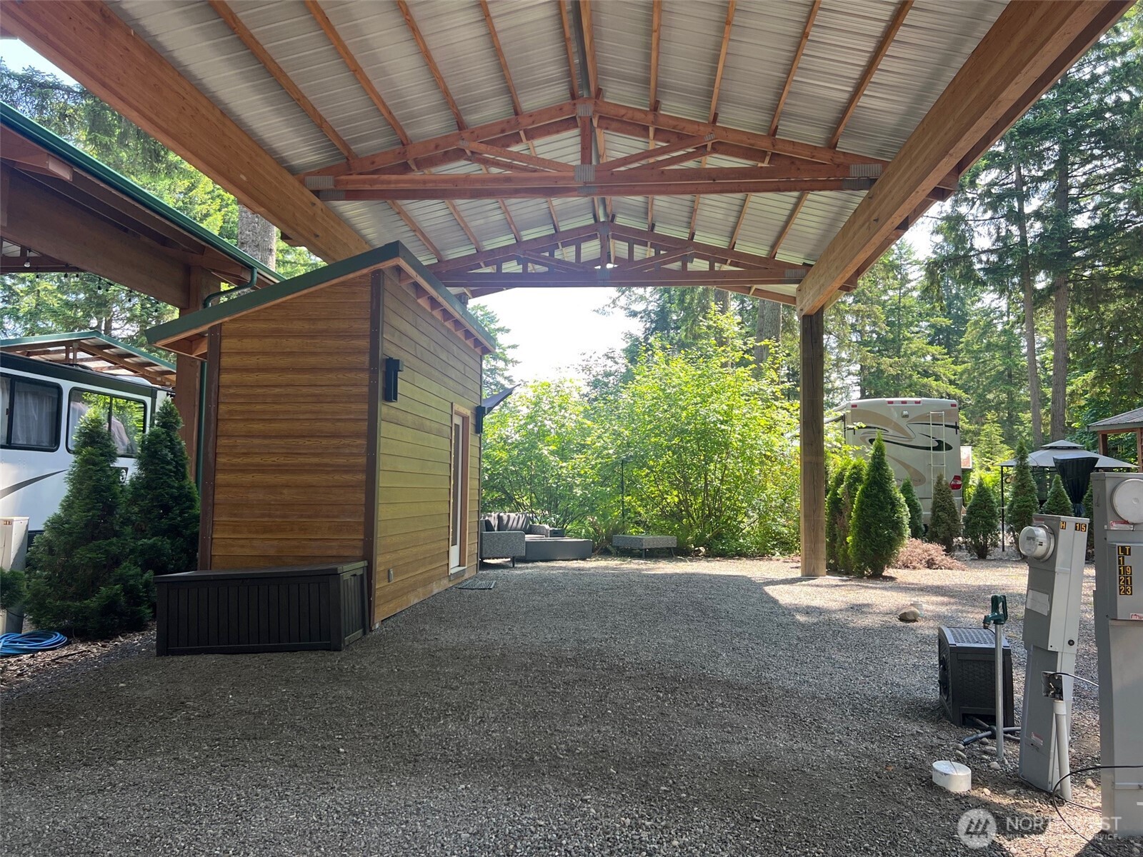 1546 Reservation Road Southeast, Unit 191 Olympia, WA 98513 - Photo 5 of 34 a view of a patio with table and chairs a barbeque grill with a small yard