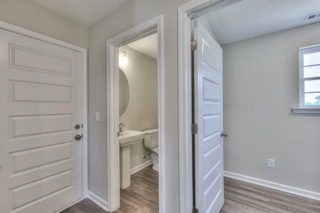 a view of a bathroom from a hallway