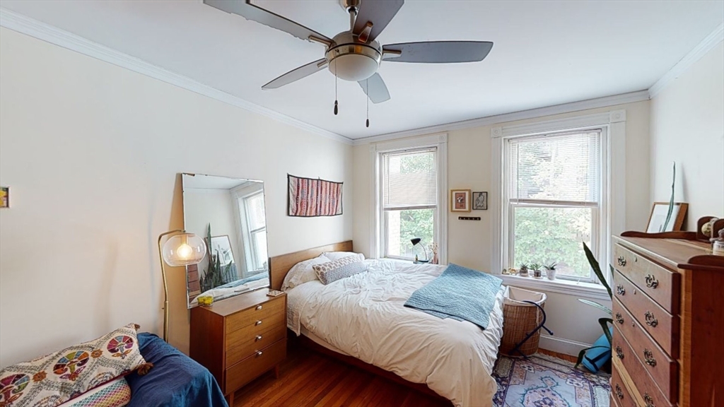 33 Walbridge Street, Unit 18 Boston, MA 02134 - Photo 1 of 13 a bedroom with a bed and a window