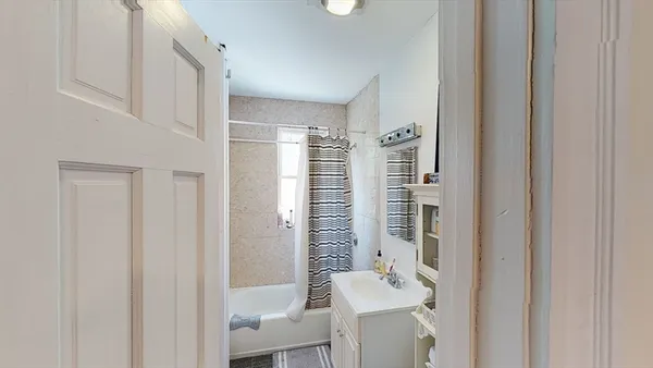 a view of a kitchen with furniture and a window