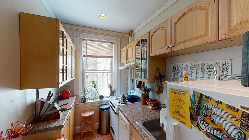 33 Walbridge Street, Unit 18 Boston, MA 02134 - Photo 6 of 13 a view of a kitchen with furniture and a window
