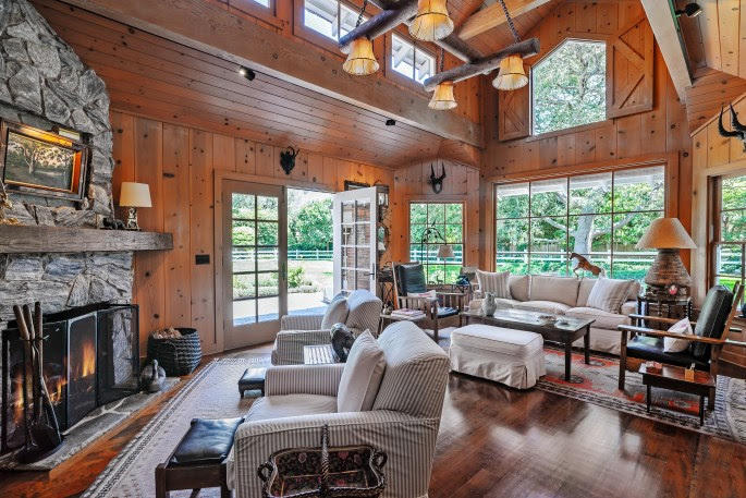1555 East Valley Road Santa Barbara, CA 93108 - Photo 6 of 18 a living room with furniture a fireplace and a large window
