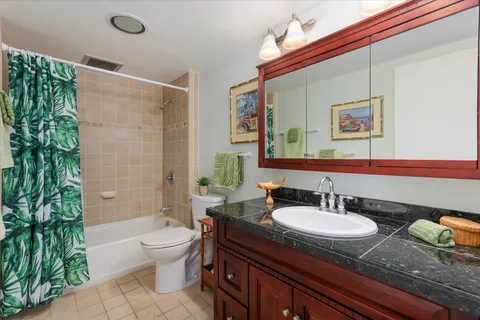 a bedroom with a bed and a cabinets