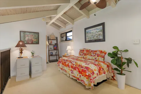 a bedroom with a bed and a book shelf