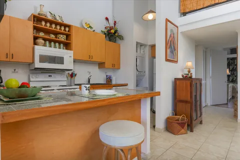 a kitchen with a sink cabinets and window