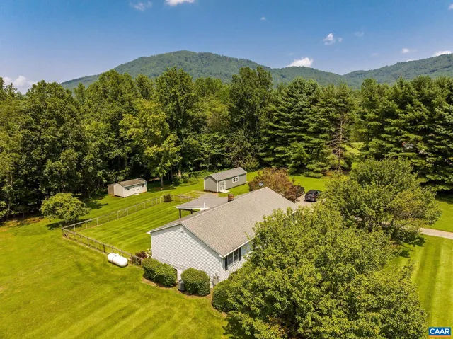 a view of a yard with an outdoor space and seating area
