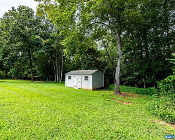 a view of a tiny house with a yard