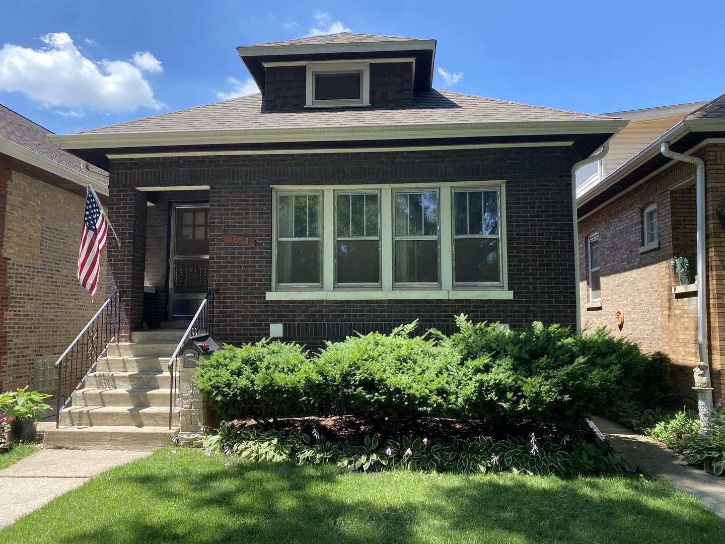 3634 Cleveland Avenue Brookfield, IL 60513 - Photo 1 of 4 a front view of a house with a yard