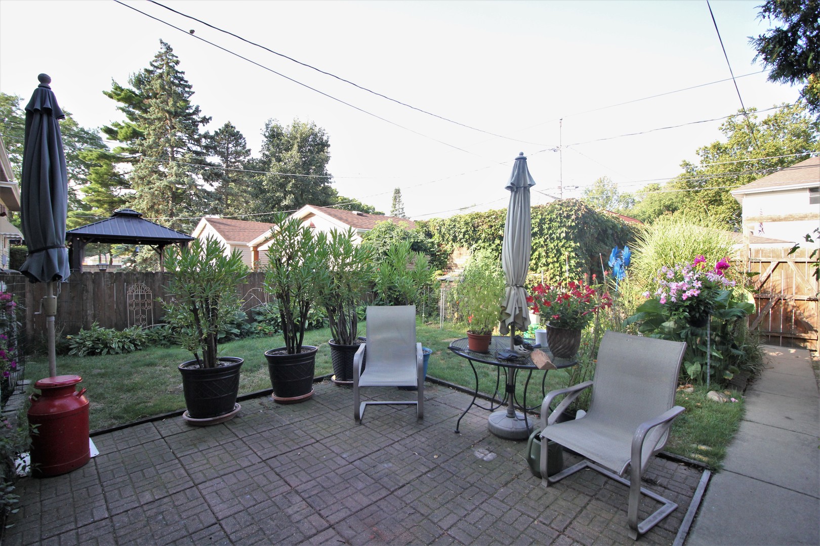 3634 Cleveland Avenue Brookfield, IL 60513 - Photo 2 of 4 a view of a patio with chairs and potted plants