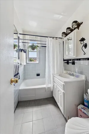 a bathroom with a bathtub sink and toilet