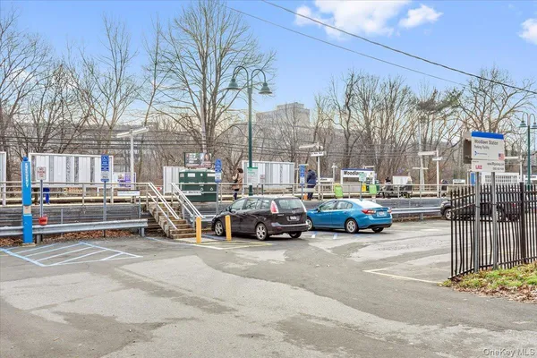 a view of a cars park in front of a building