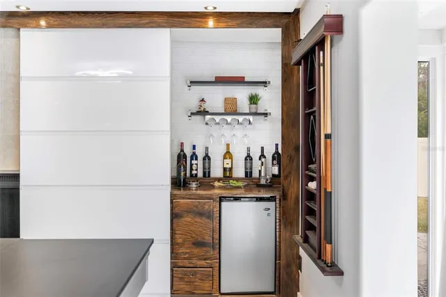 a kitchen with a refrigerator and countertop