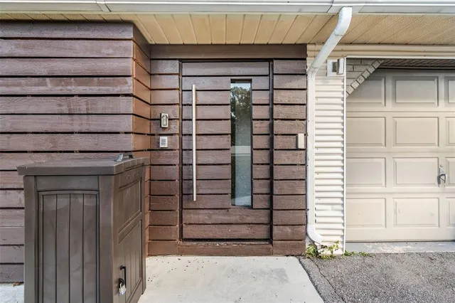 a front view of a house with a garage