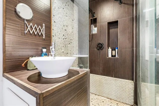 a bathroom with a sink and a mirror