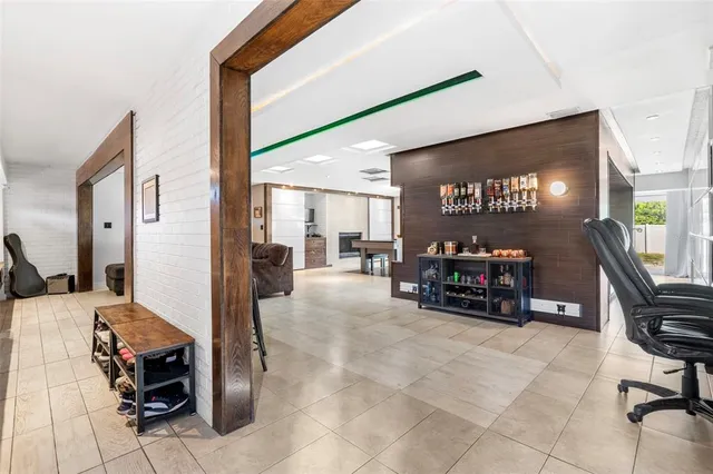 a en suite bathroom with sink a bathtub and next to a window