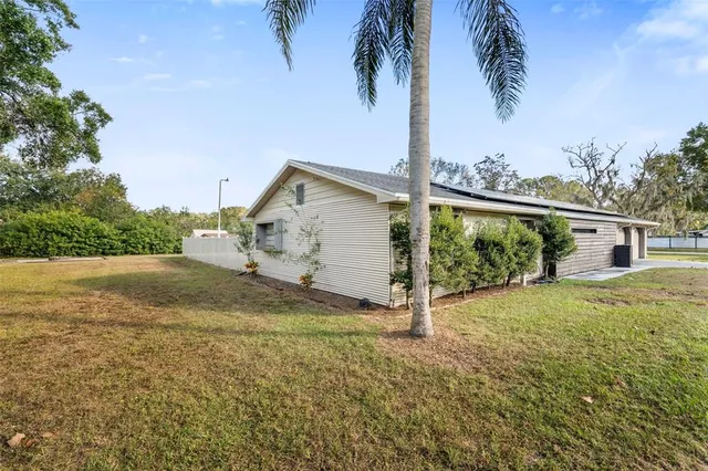 view of a yard with large trees
