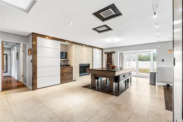 a view of a dining room with furniture and window