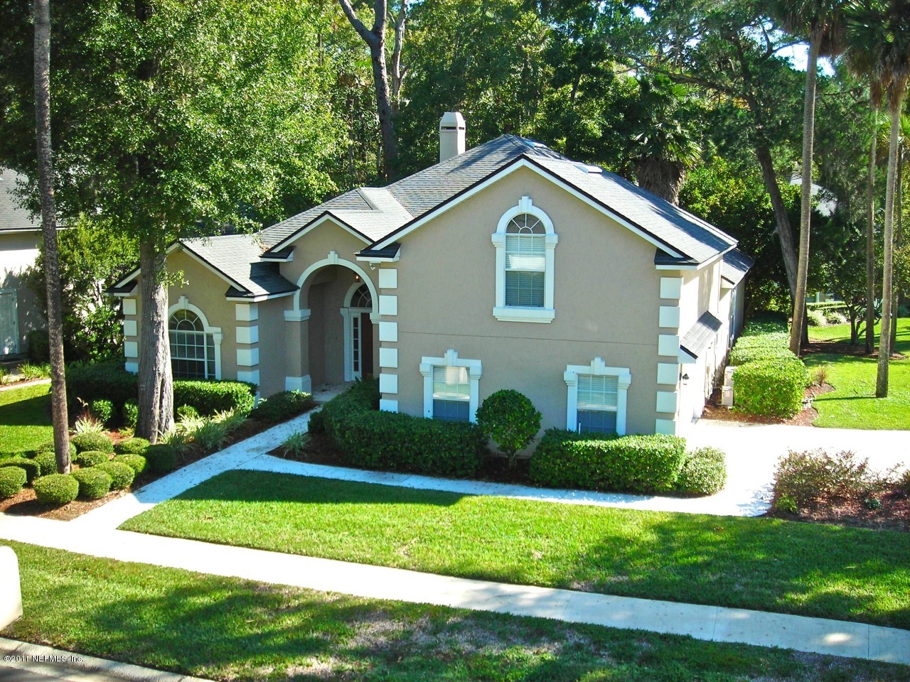 860 Mill Stream Road Ponte Vedra, FL 32082 - Photo 1 of 28 a front view of a house with a yard