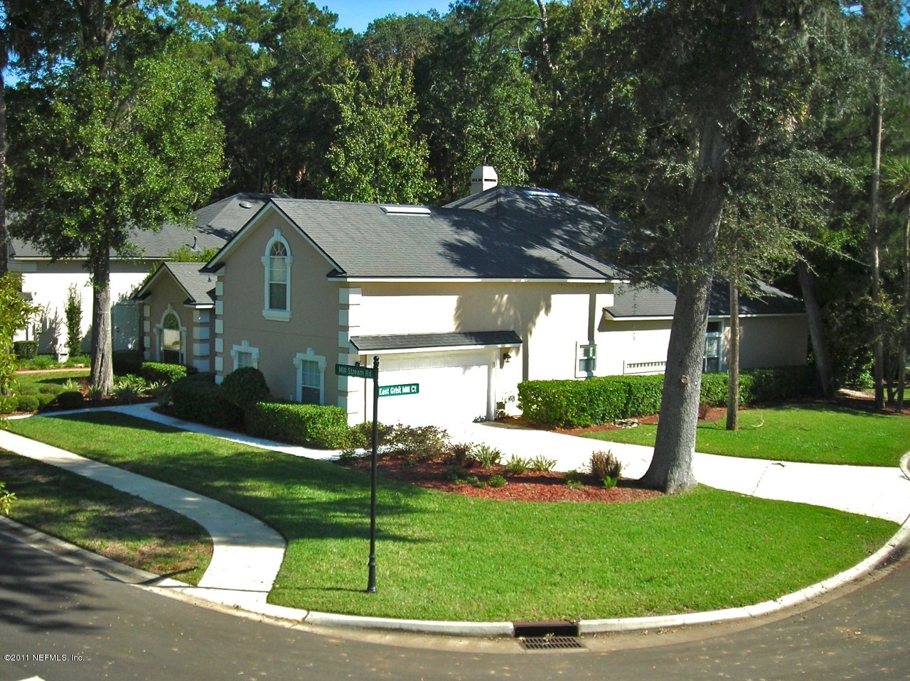 860 Mill Stream Road Ponte Vedra, FL 32082 - Photo 6 of 28 a view of a house with a big yard plants and large trees