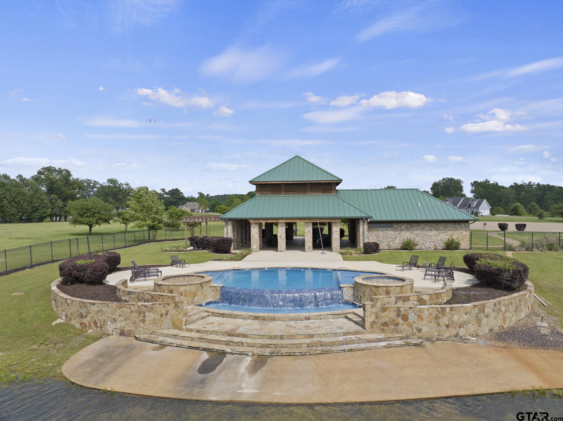 Lot 26 Private Road Mount Pleasant, TX 75455 - Photo 16 of 20 a view of a house with pool and a yard