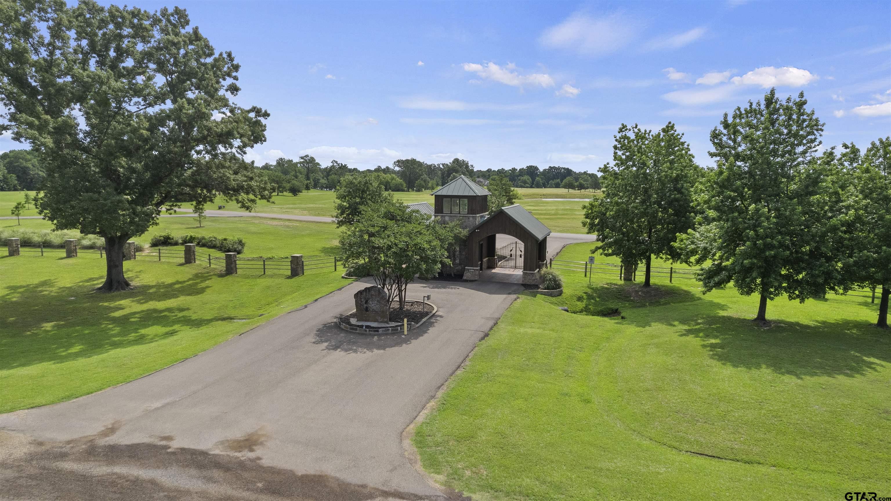 Lot 26 Private Road Mount Pleasant, TX 75455 - Photo 20 of 20 a view of a garden with a slide and a lake view