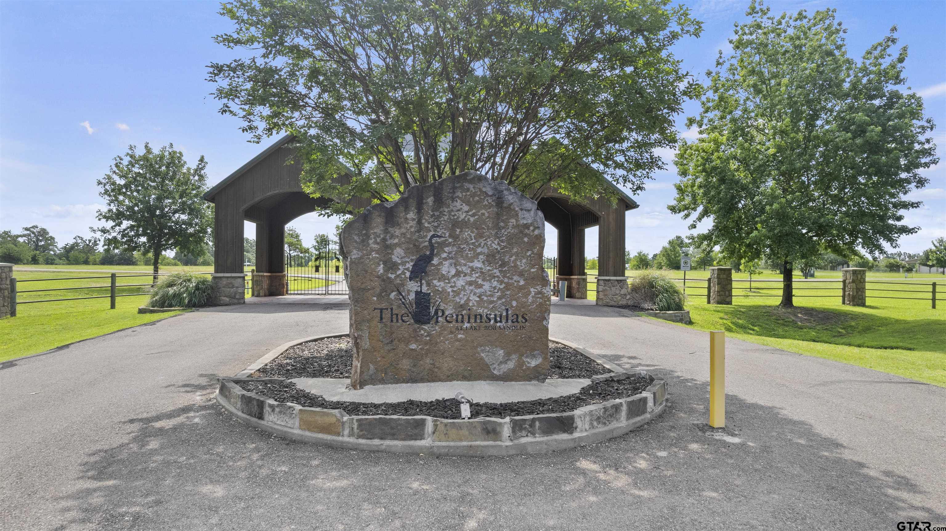 Lot 26 Private Road Mount Pleasant, TX 75455 - Photo 3 of 20 a view of a house with a yard and tree s