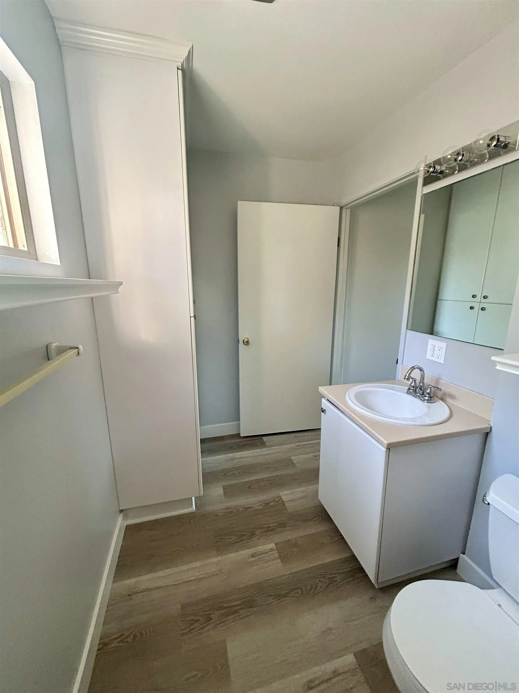 225 Melrose Avenue, Unit 1 Encinitas, CA 92024 - Photo 11 of 16 a bathroom with a sink toilet and shower