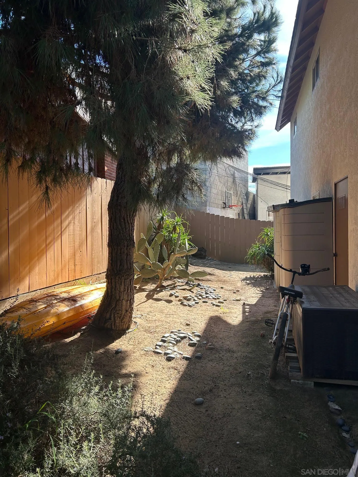 225 Melrose Avenue, Unit 1 Encinitas, CA 92024 - Photo 12 of 16 a view of a yard with a tree