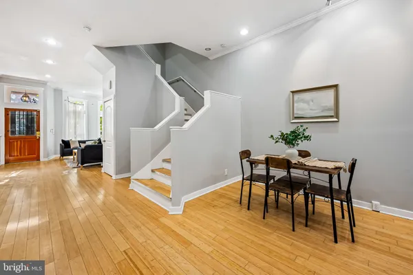 a view of a room with furniture and wooden floor