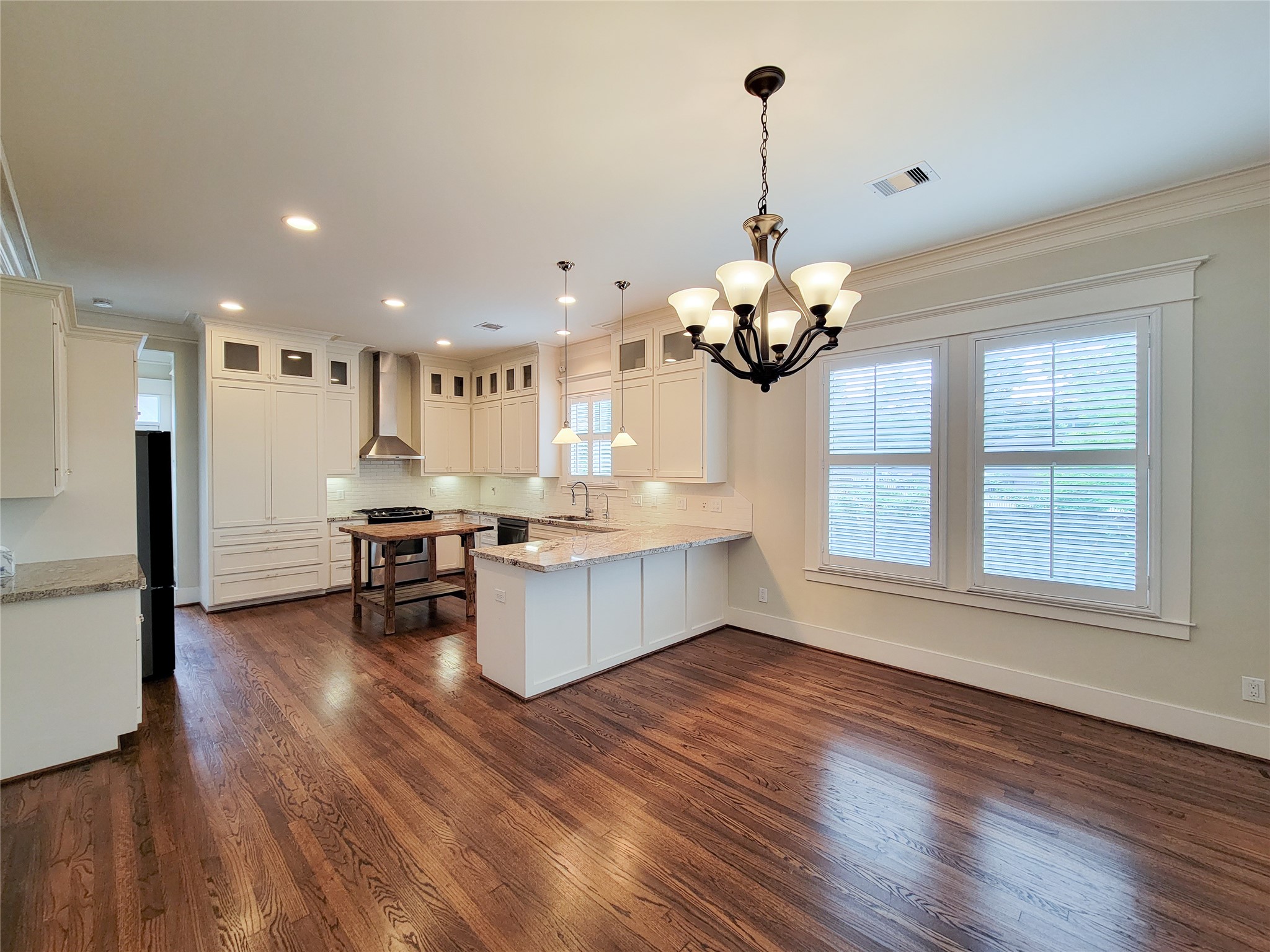 1140 West Cottage Street Houston, TX 77009 - Photo 13 of 37 a view of a room with wooden floor and a window