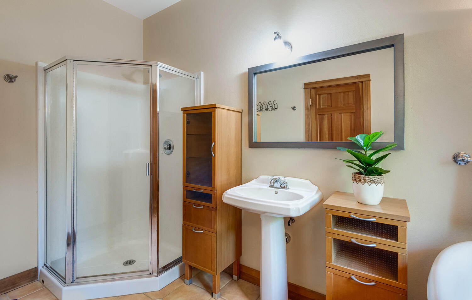 19007 Innes Market Road Bend, OR 97703 - Photo 16 of 39 a bathroom with a sink a mirror a toilet and a shower