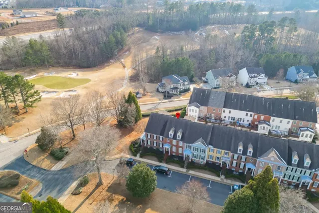 a view of a house with a yard from a balcony